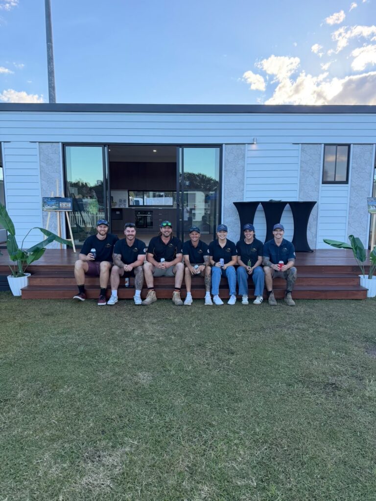 Duncon Electrical team at the Sunshine Coast Tiny Home show discussing offgrid solar and modular home power solutions.